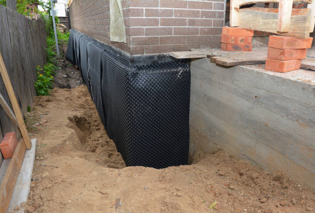 Happy homeowners after waterproofing job in Auburndale